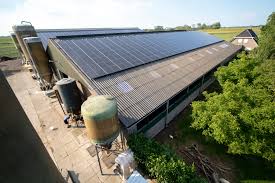 Solar panels on a large farm outbuilding.